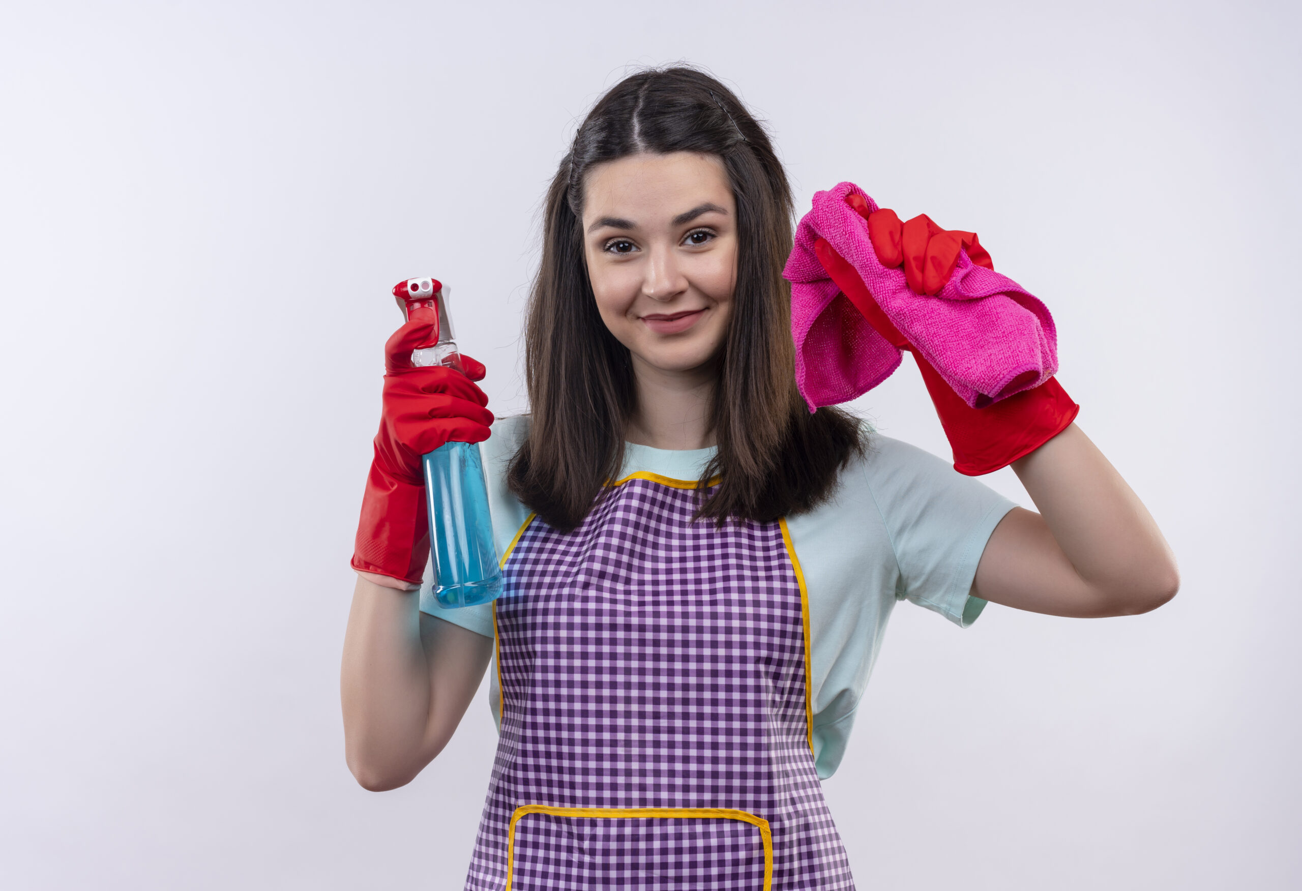 Young Beautiful Girl Apron Rubber Gloves Holding Cleaning Spray Rug Looking Camera Smiling Cheerfully Ready Cleaning Scaled